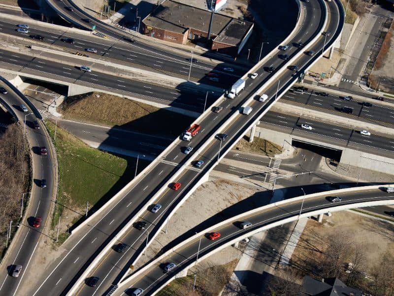 Aerial view of a multi level highway interchange showing regional transportation corridor design